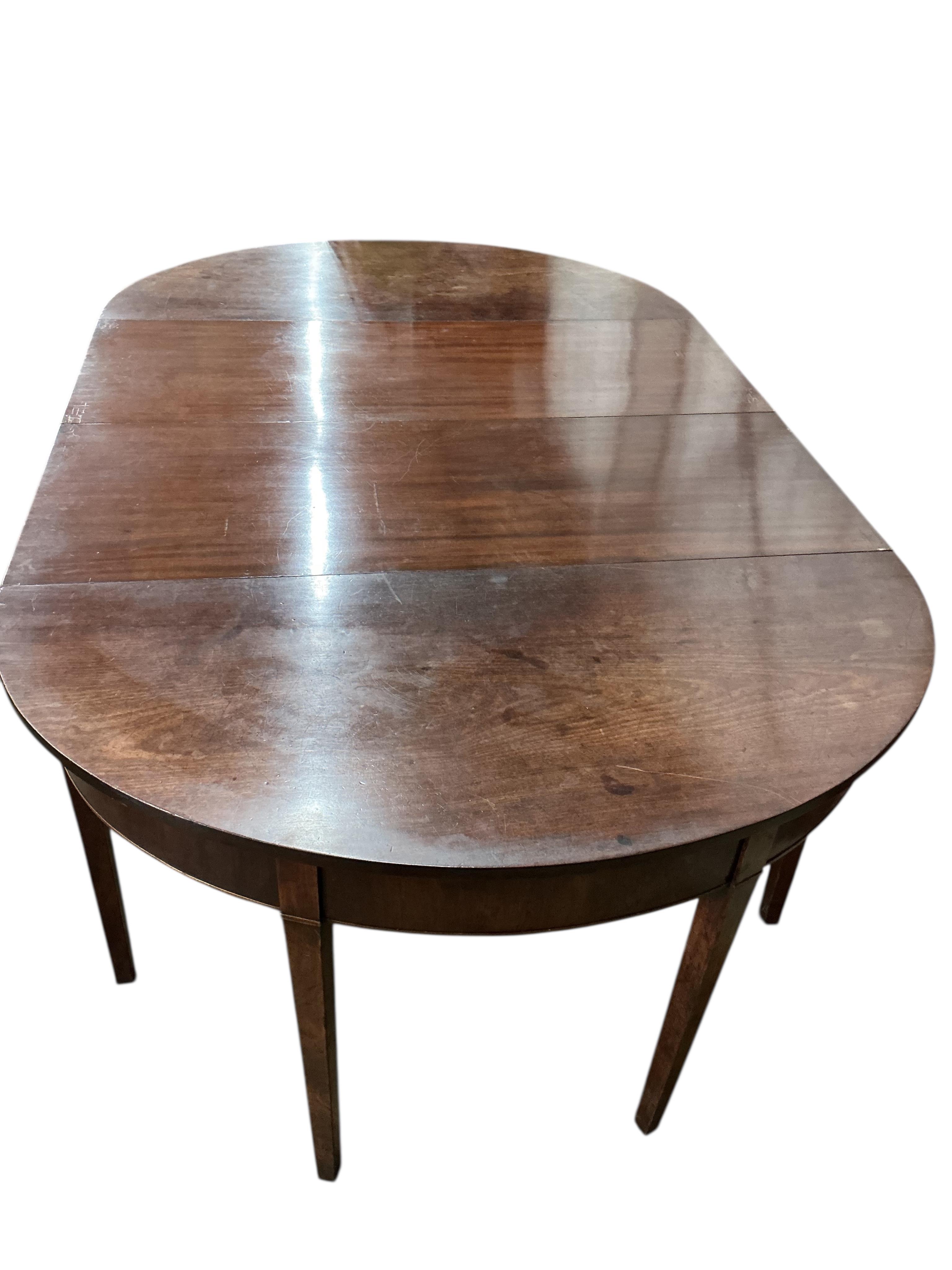 A George III mahogany D end extending dining table, width 194cm extended, two spare leaves , depth 118cm, height 73cm (no clips)